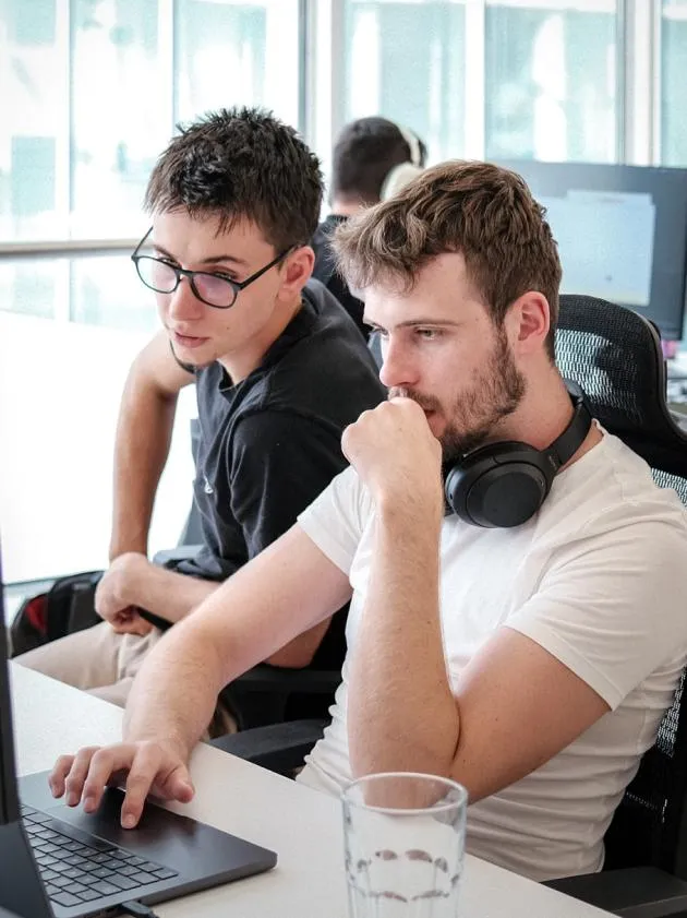KOALA42 developers at a laptop